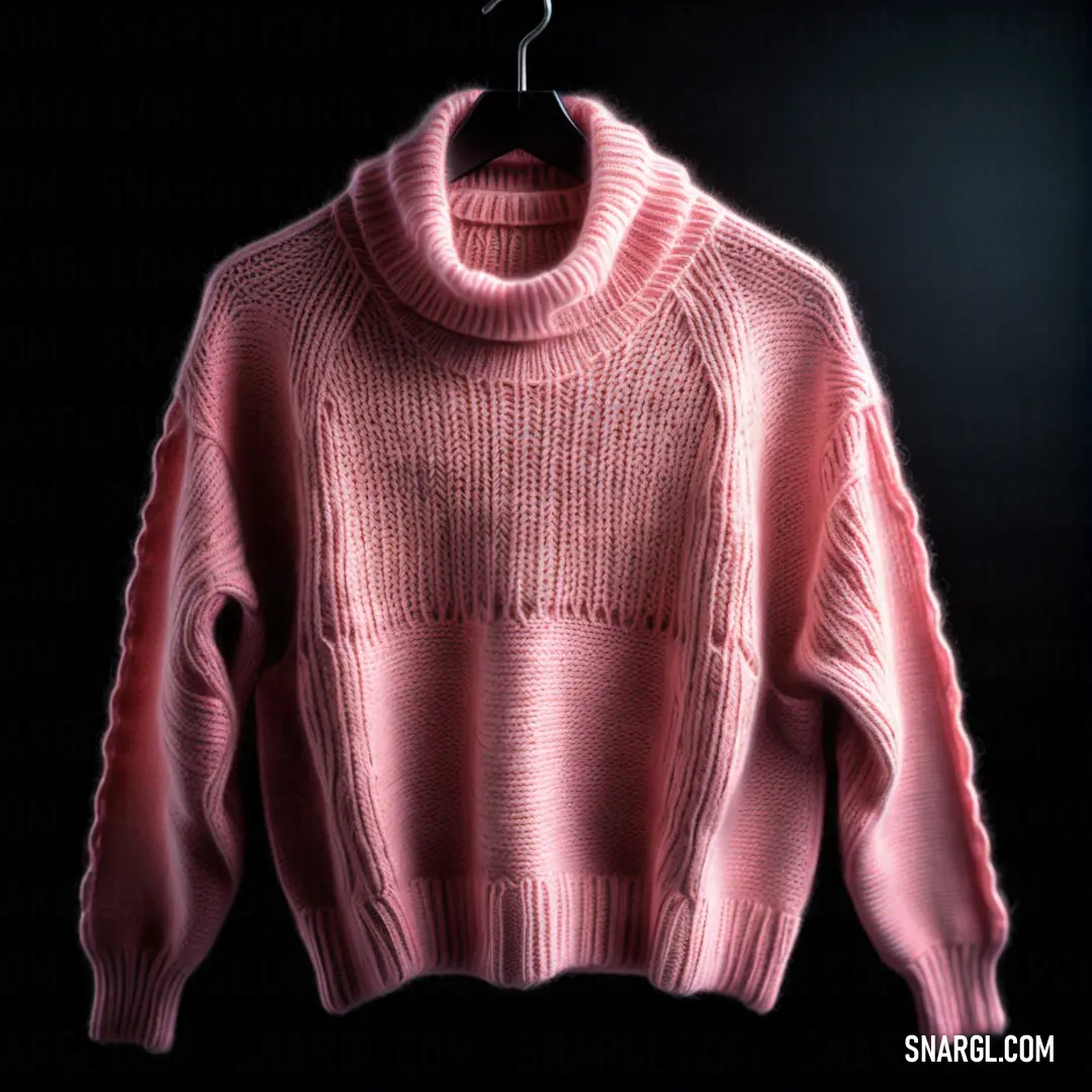 Pink sweater hanging on a black background