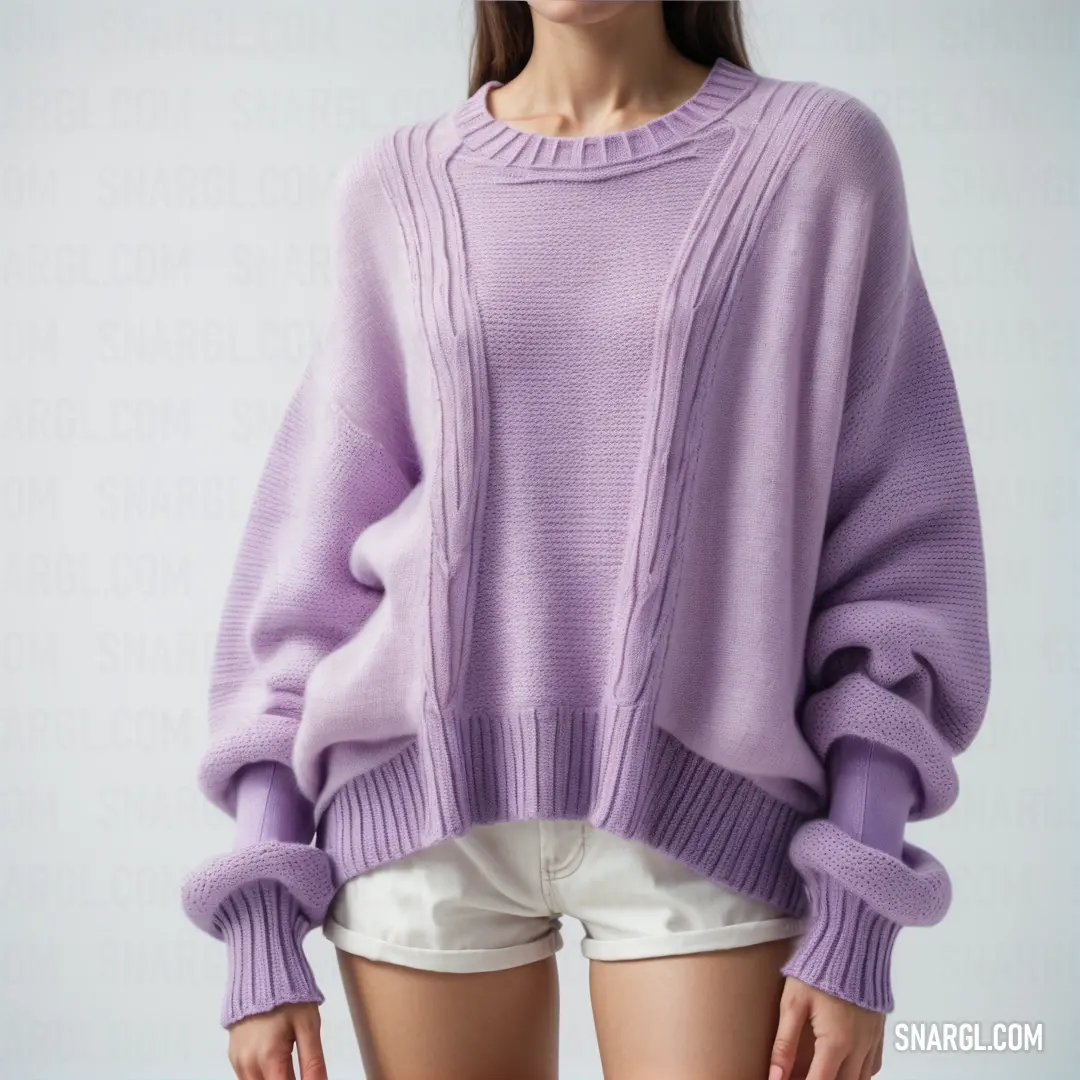 Woman in a purple sweater and white shorts is posing for a picture with her hands in her pockets