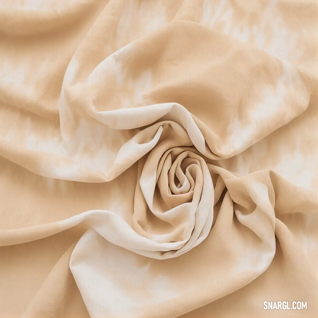 Close up of a white and beige fabric with a knoted design on it's center piece. Example of #EFDECD color.