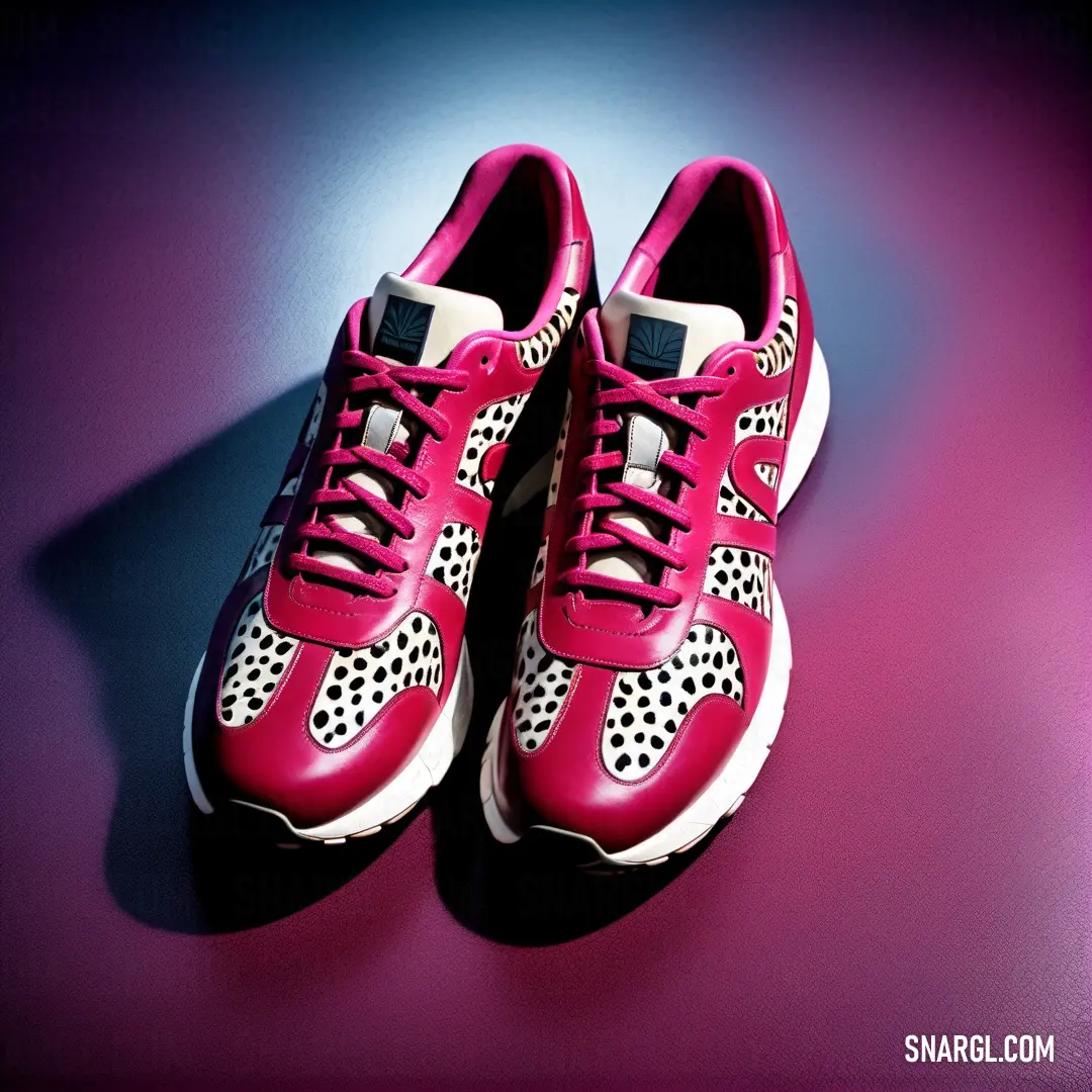 Pair of red shoes with white and black dots on them on a purple surface with a shadow of a person. Example of #E52B50 color.