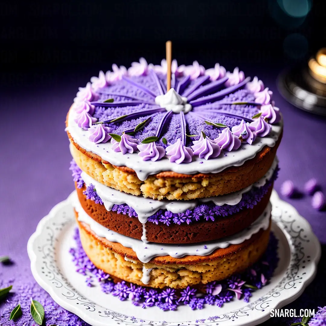 Cake with purple frosting and a purple umbrella on top of it on a plate with purple flowers. Example of Amethyst color.