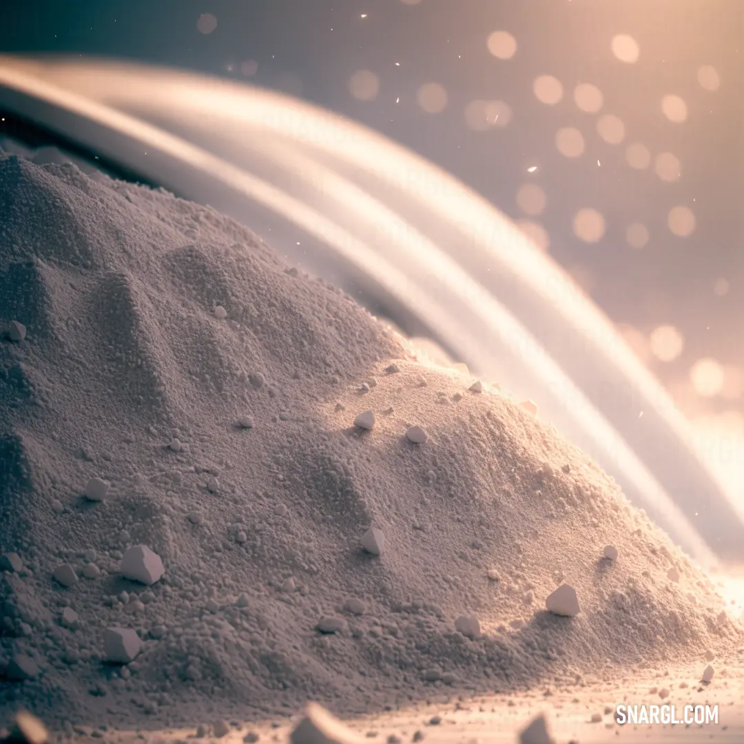 Pile of white sand on top of a beach next to a white surfboard on a sandy beach