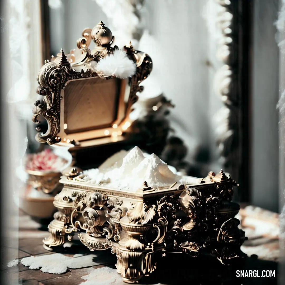 Mirror and a table with a bowl of powder on it and a mirror in the background with a white feathered edge