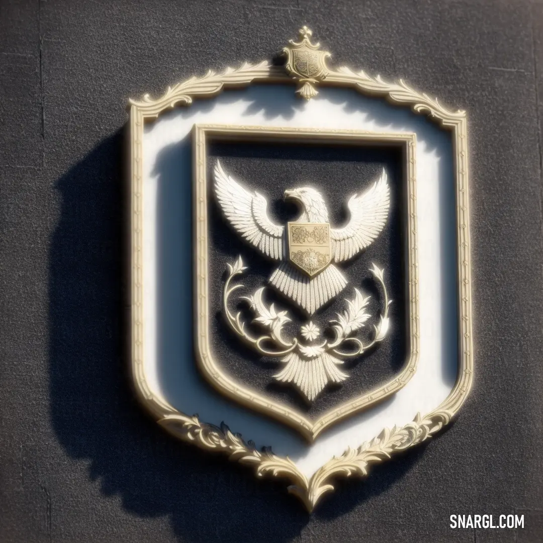 White and gold emblem on a black wall with a bird on it's back side and a star on the top