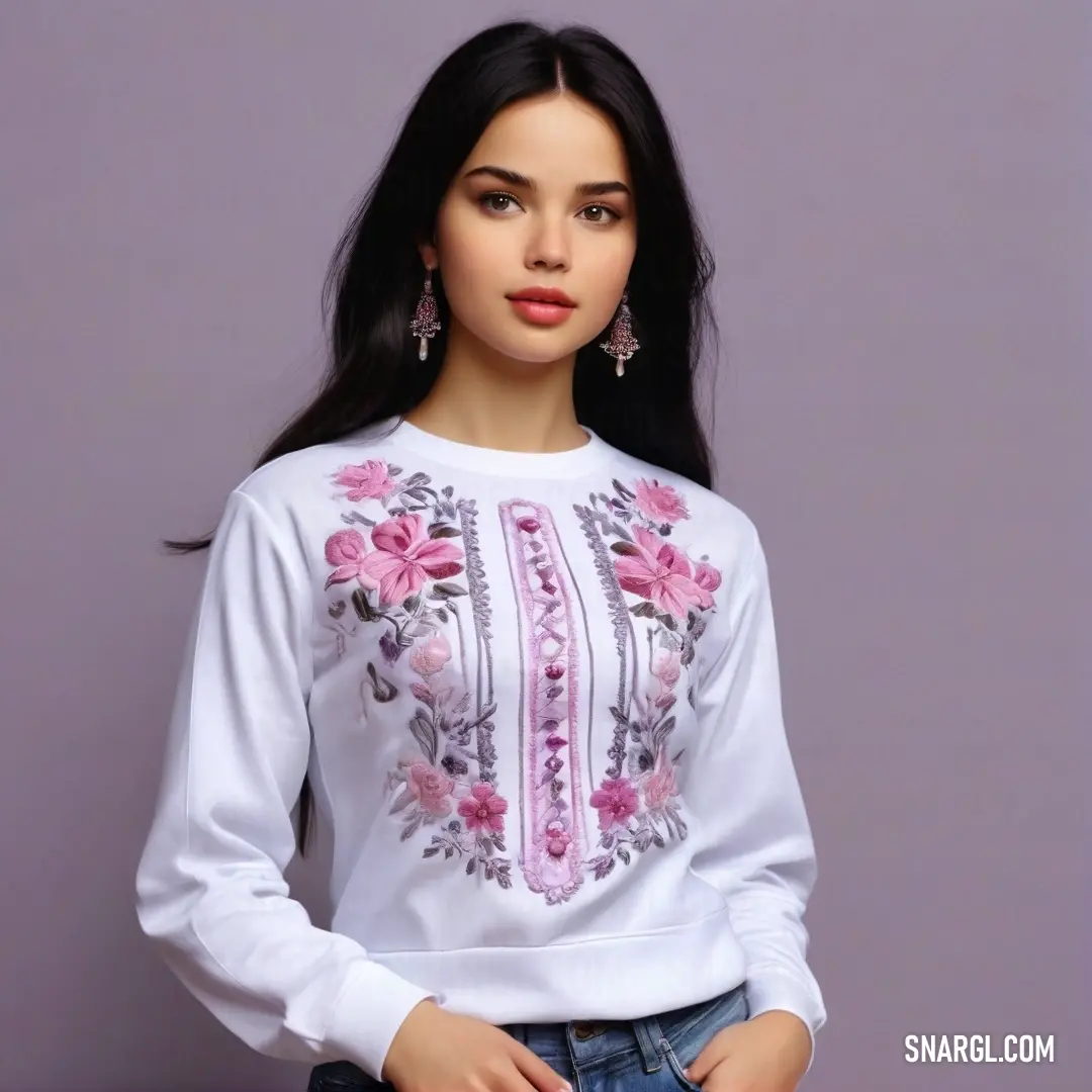 A woman wearing a soft white shirt with delicate pink flowers, paired with casual jeans that feature an intricate floral design. The gentle pastel tones offer a calm and welcoming feel.