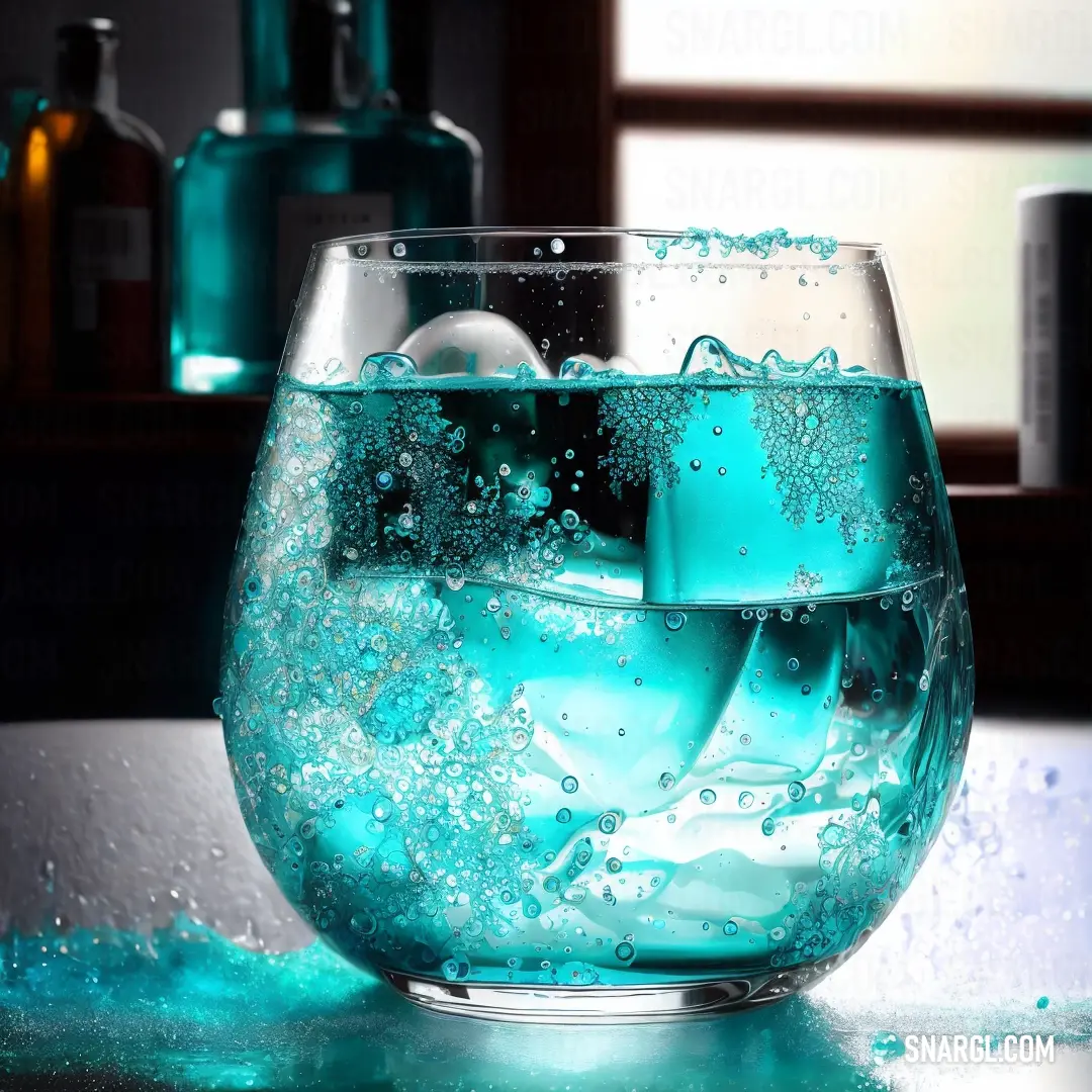 Glass filled with blue liquid on top of a table next to bottles of alcohol