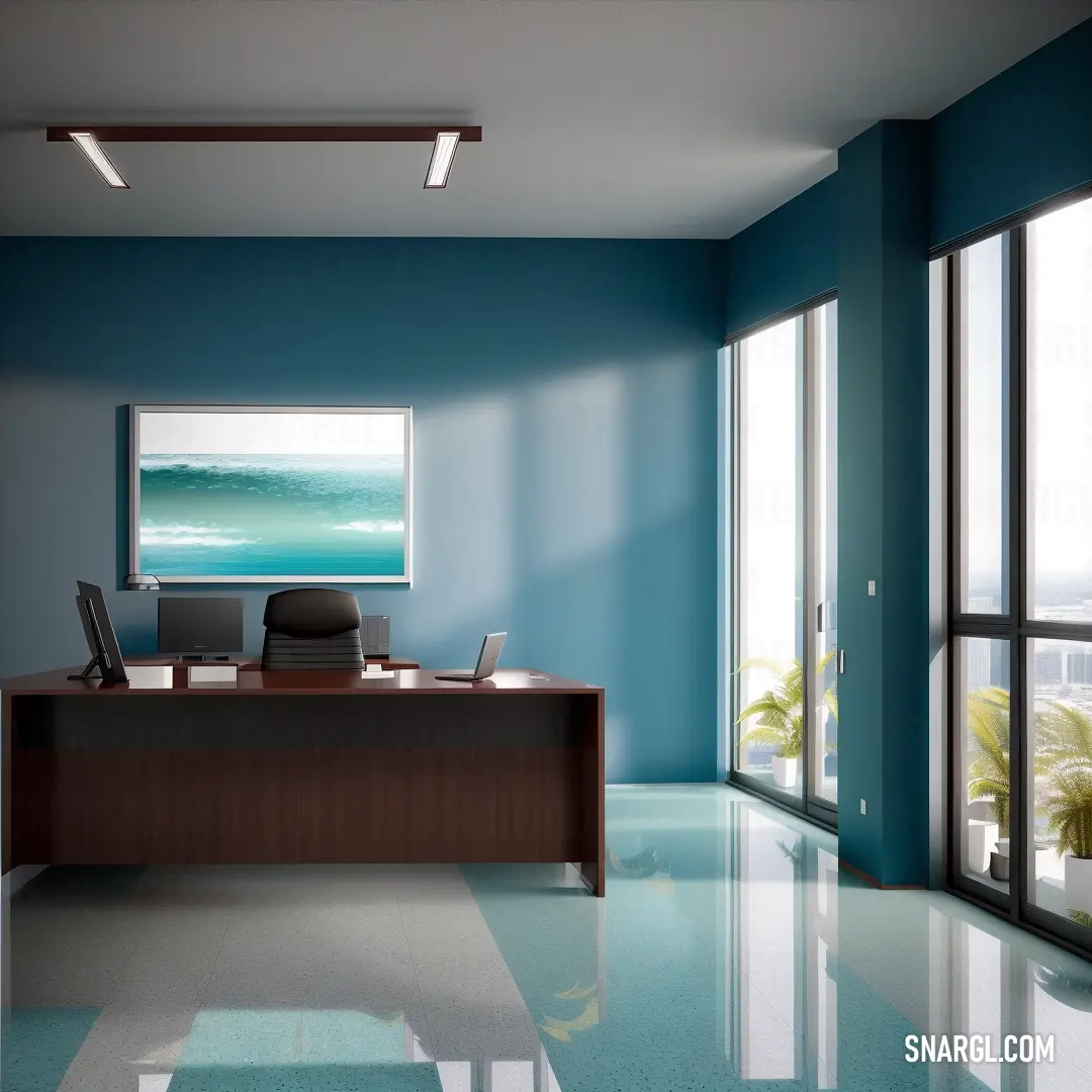 Room with a desk and a large window with a view of the ocean and a beach in the distance