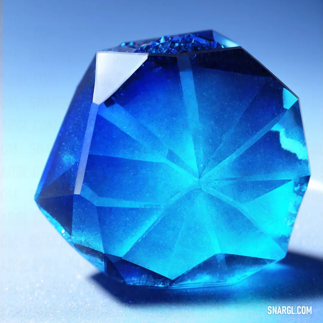 Blue diamond is shown on a white surface with a blue background and a blue background