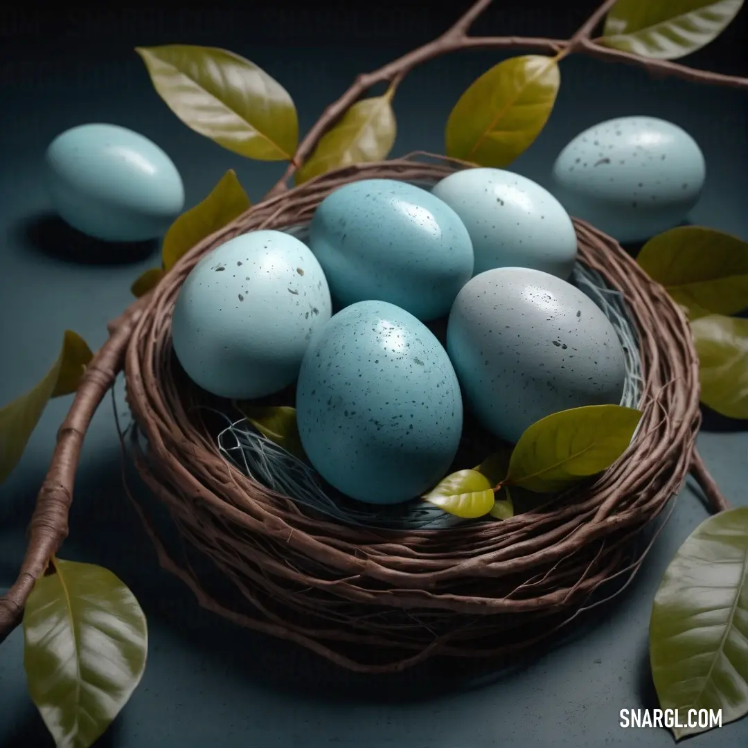 Baby blue color example: Nest of eggs with leaves and leaves around it on a table with blue and green eggs in it