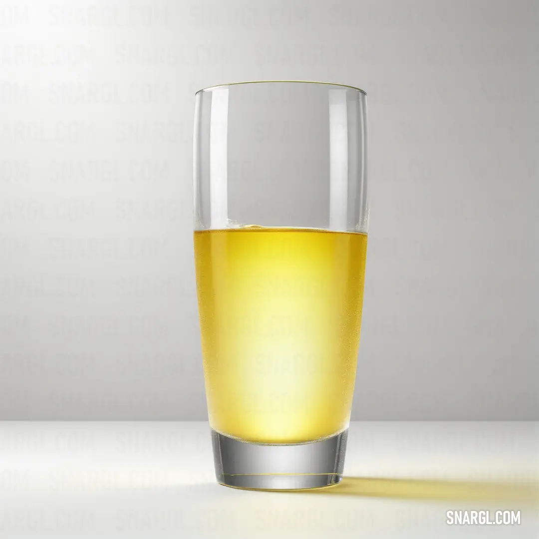 Glass of beer on a table with a white background. Example of CMYK 0,12,79,0 color.
