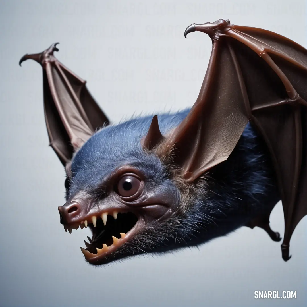 Bat with its mouth open and it's teeth wide open