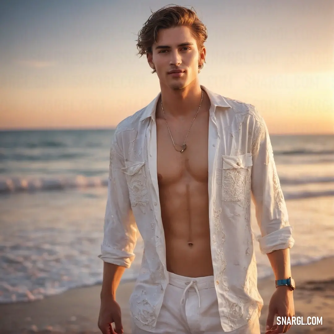 Man standing on a beach next to the ocean at sunset with his shirt off