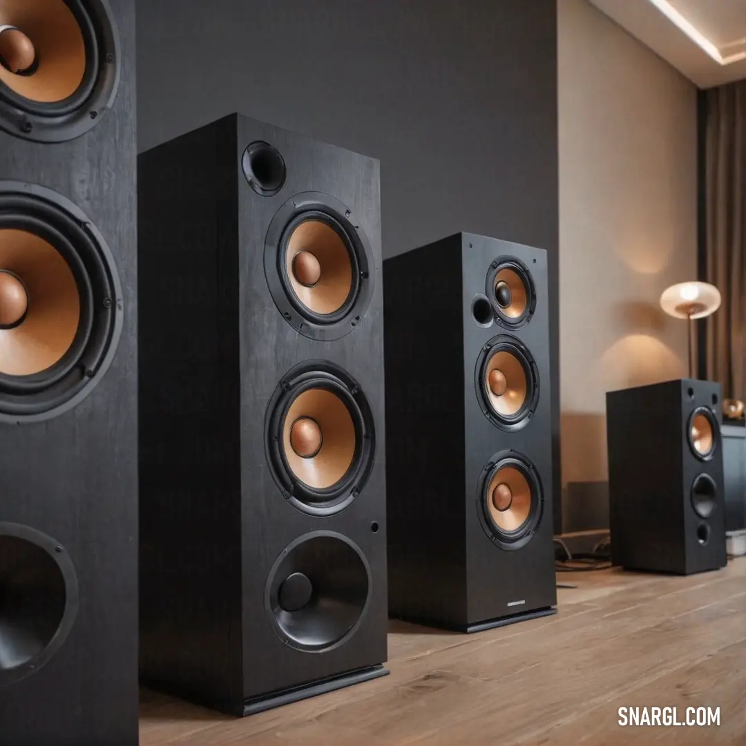 An elegant arrangement of speakers elegantly positioned on a polished wooden floor. Soft light filters through the curtains nearby, illuminating the scene and enhancing its inviting atmosphere, perfect for music lovers and home entertainment enthusiasts.