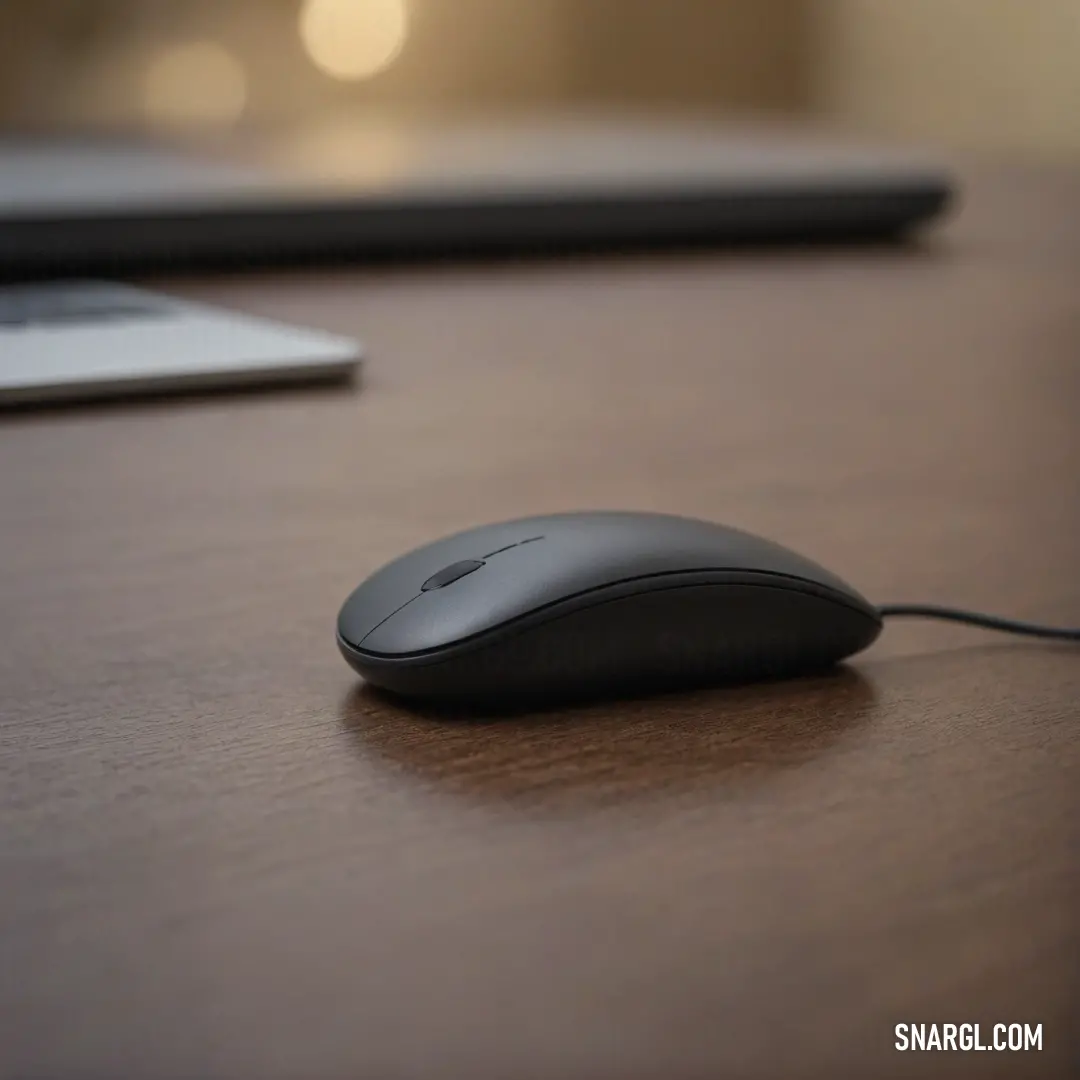 A sleek computer mouse resting on a polished wooden desk, paired next to a modern laptop. The warm tones of the wood create a cozy workspace ambiance, showcasing the perfect blend of technology and tranquility for productivity.