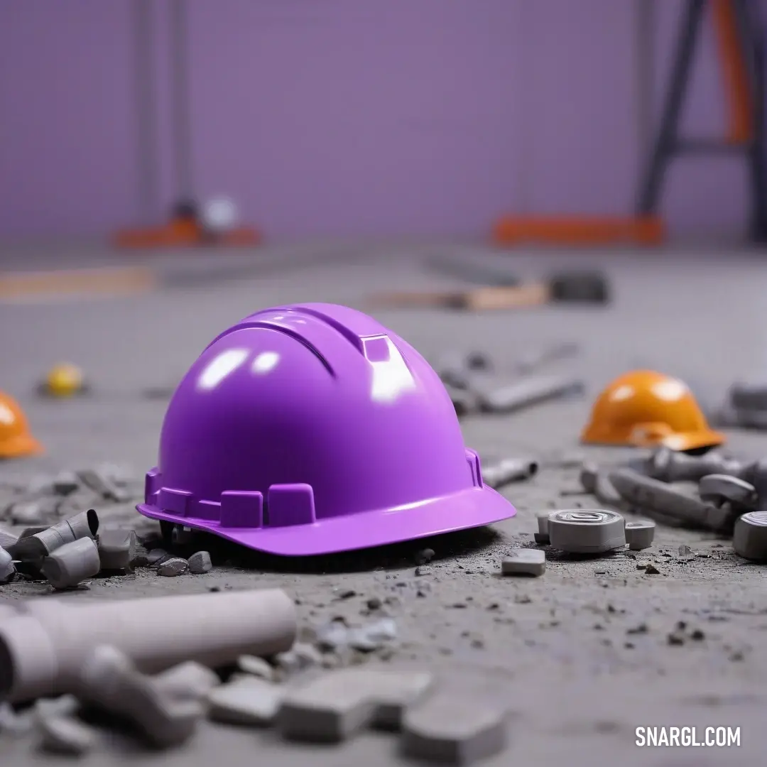 Purple hard hat laying on the ground surrounded by construction tools. Color RGB 138,43,226.
