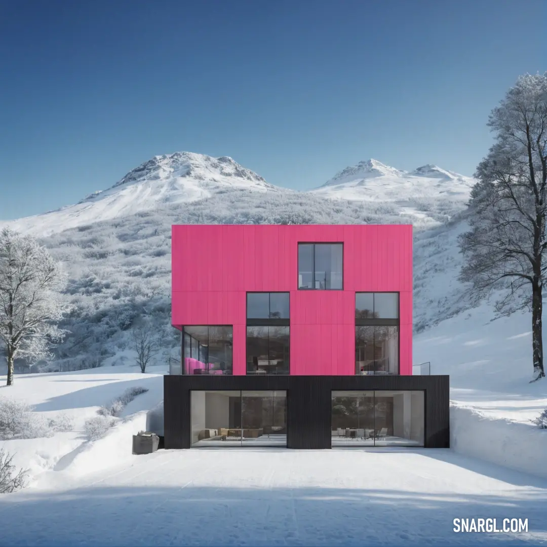 Blush color. Pink building with a mountain in the background