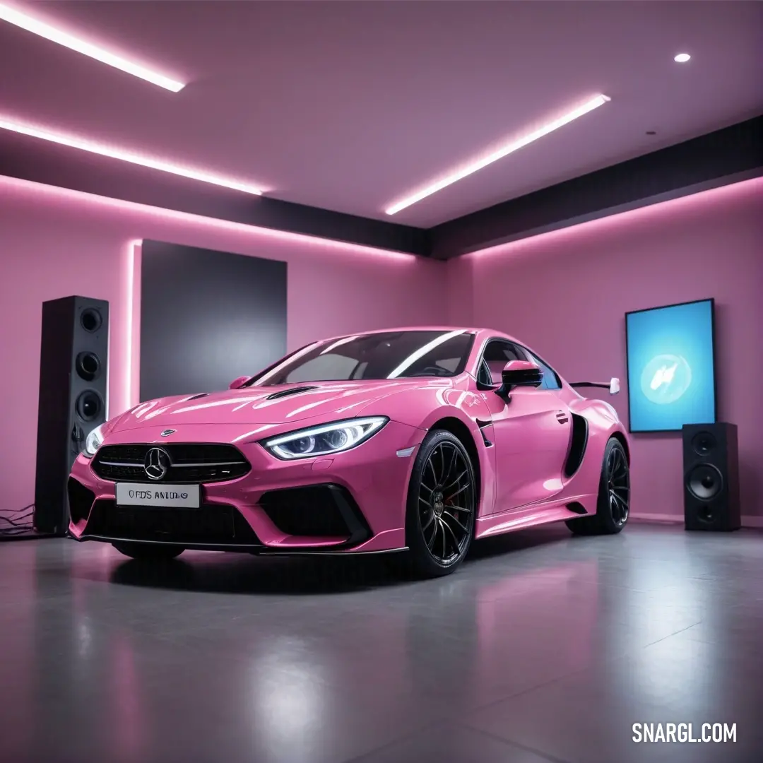 Pink car is parked in a room with speakers and a tv on the wall behind it. Example of CMYK 0,58,41,13 color.