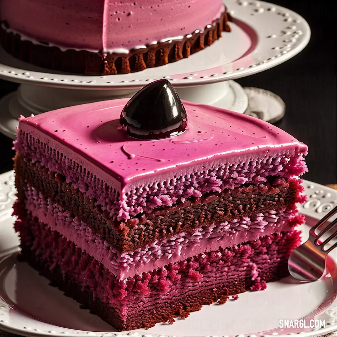 Slice of cake with pink frosting on a plate with a fork
