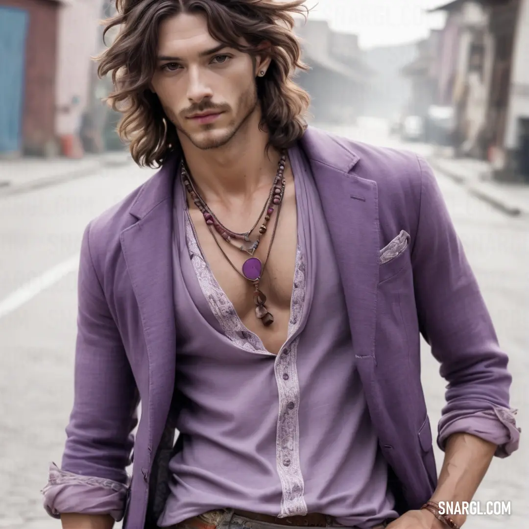 Man with long hair and a purple shirt is standing on a street corner with a necklace on his neck