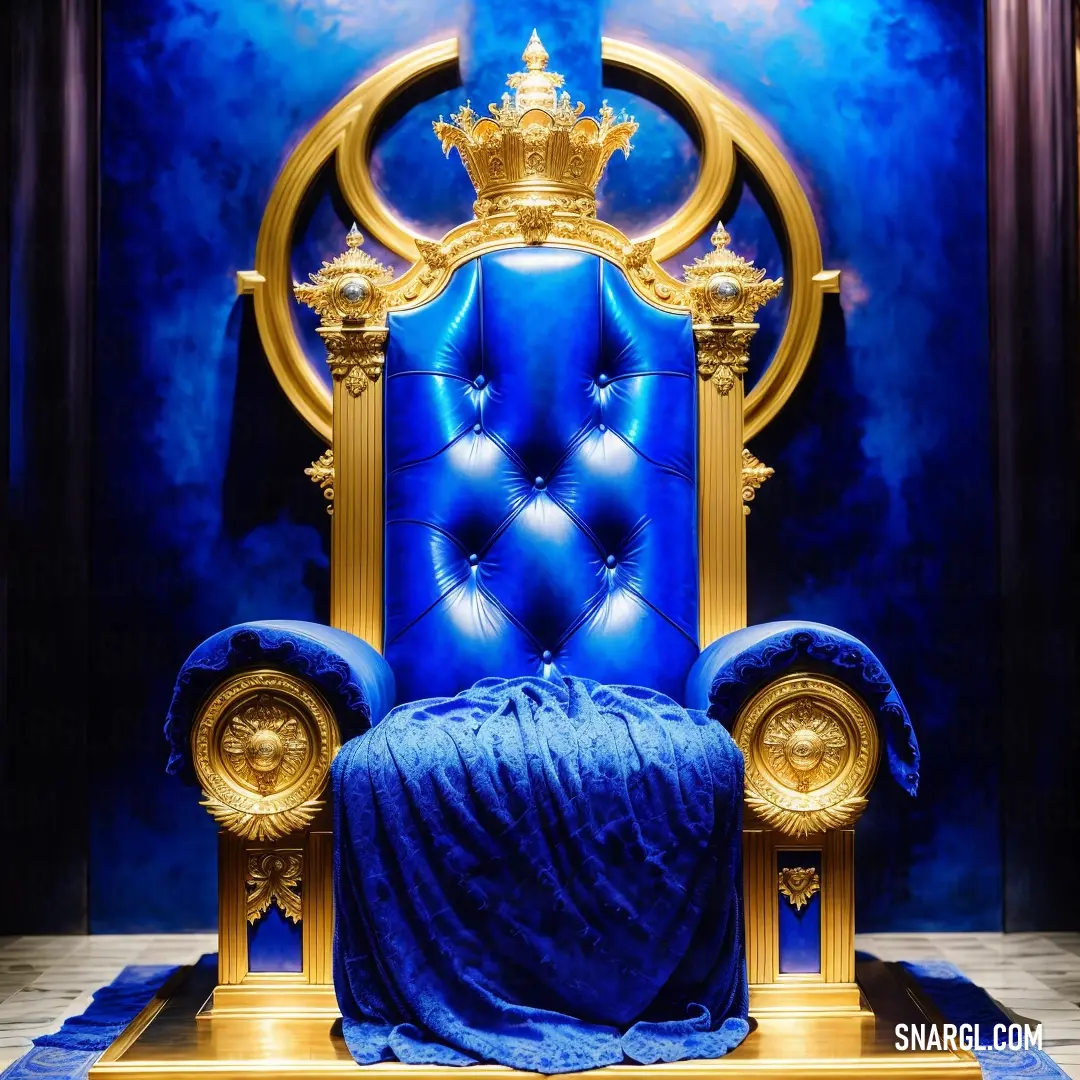 Blue chair with a gold crown on top of it in a room with blue walls