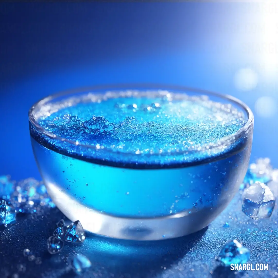 Bowl of blue liquid with bubbles on a table top with a blue background and a blue background