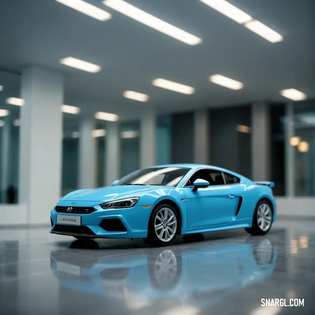 Bright cerulean color. Blue car parked in a building with a lot of windows on the ceiling