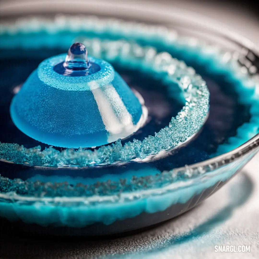 Bright cerulean color. Blue bowl with a blue lid and a blue base with a blue top and a white base