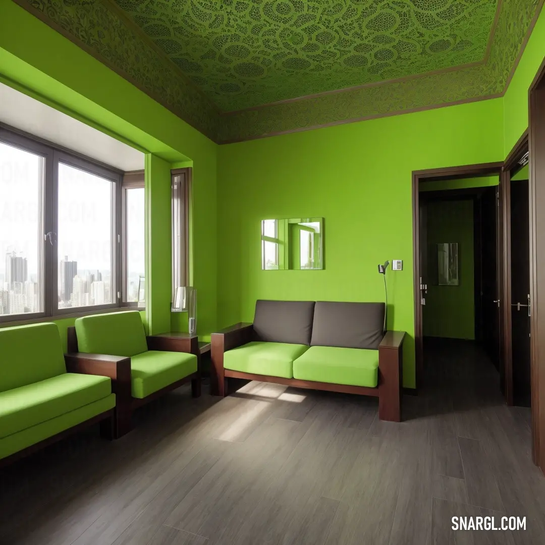 Living room with green walls and a couch and a chair in it and a window with a city view