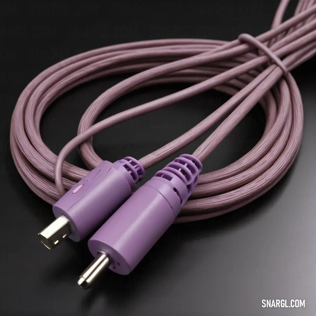 Purple cable with two plugs on it on a black surface. Color Bright ube.