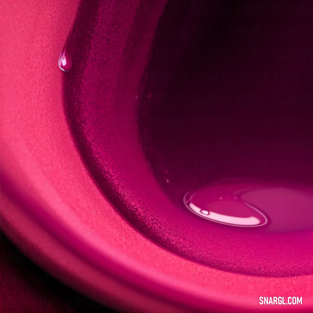 Pink toilet with a water drop in it's bowl and a black background with a white border