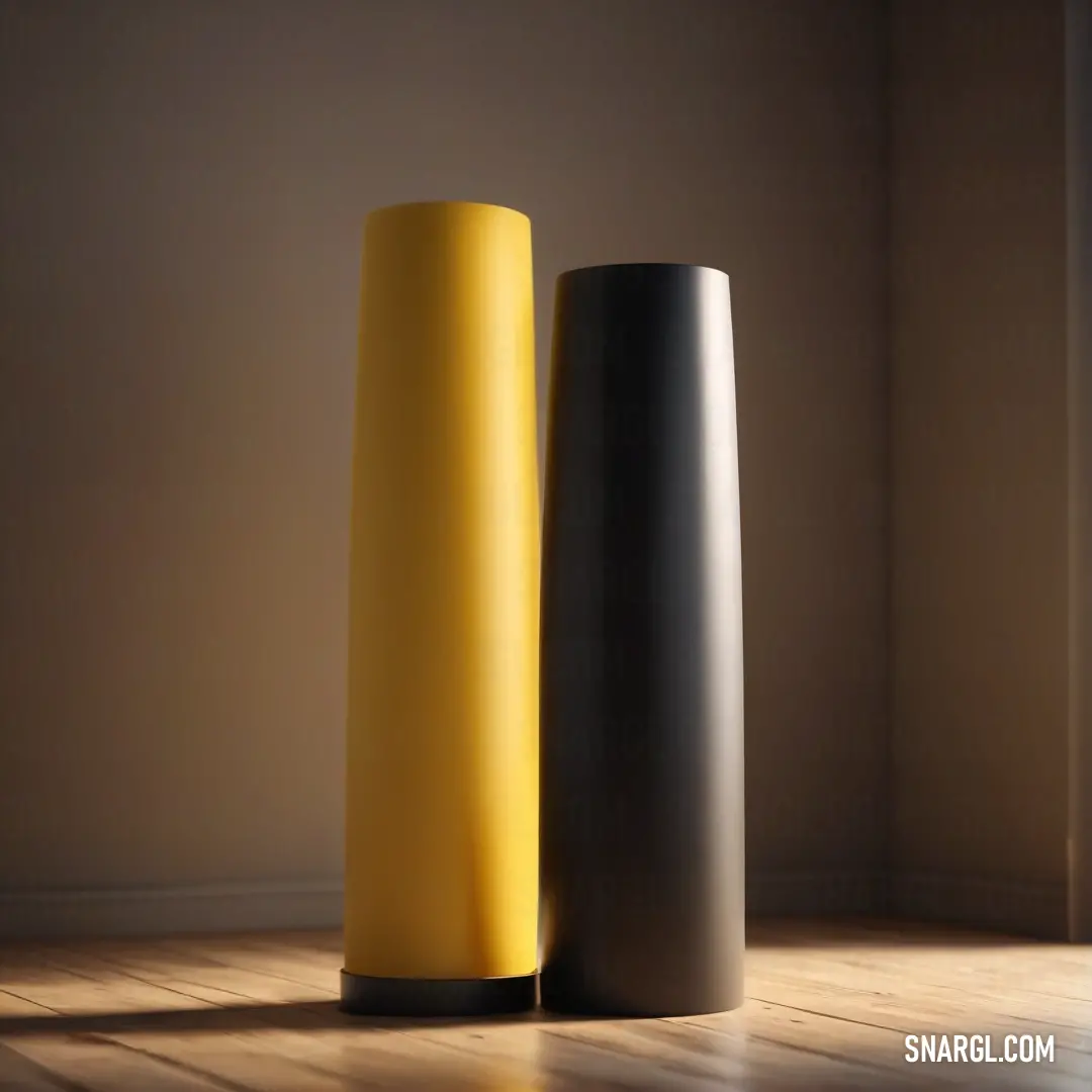 Buff color. Two tall vases on a wooden floor in a room with a wall in the background