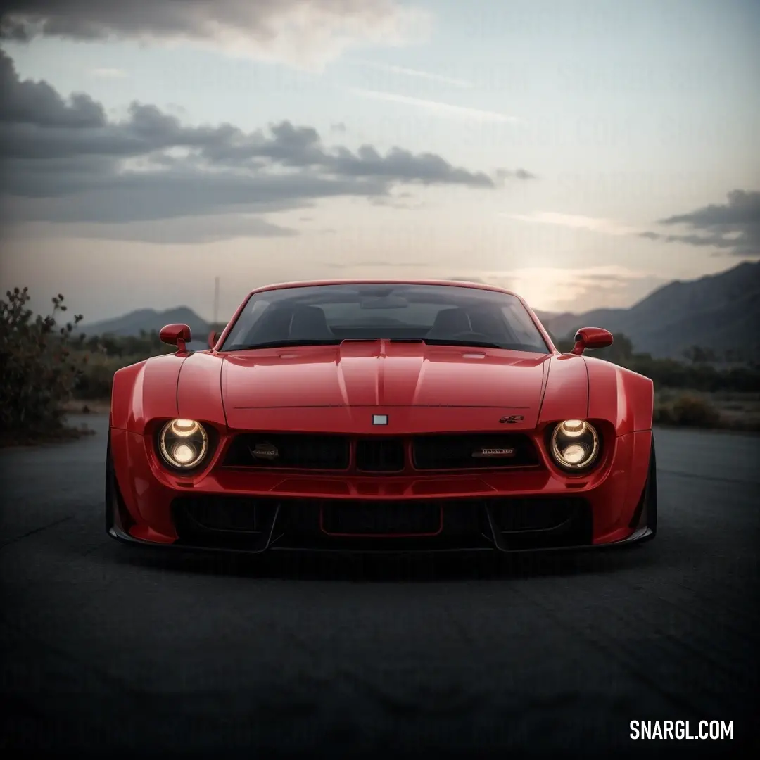 Red sports car parked on a road with mountains in the background at sunset or dawn with clouds in the sky