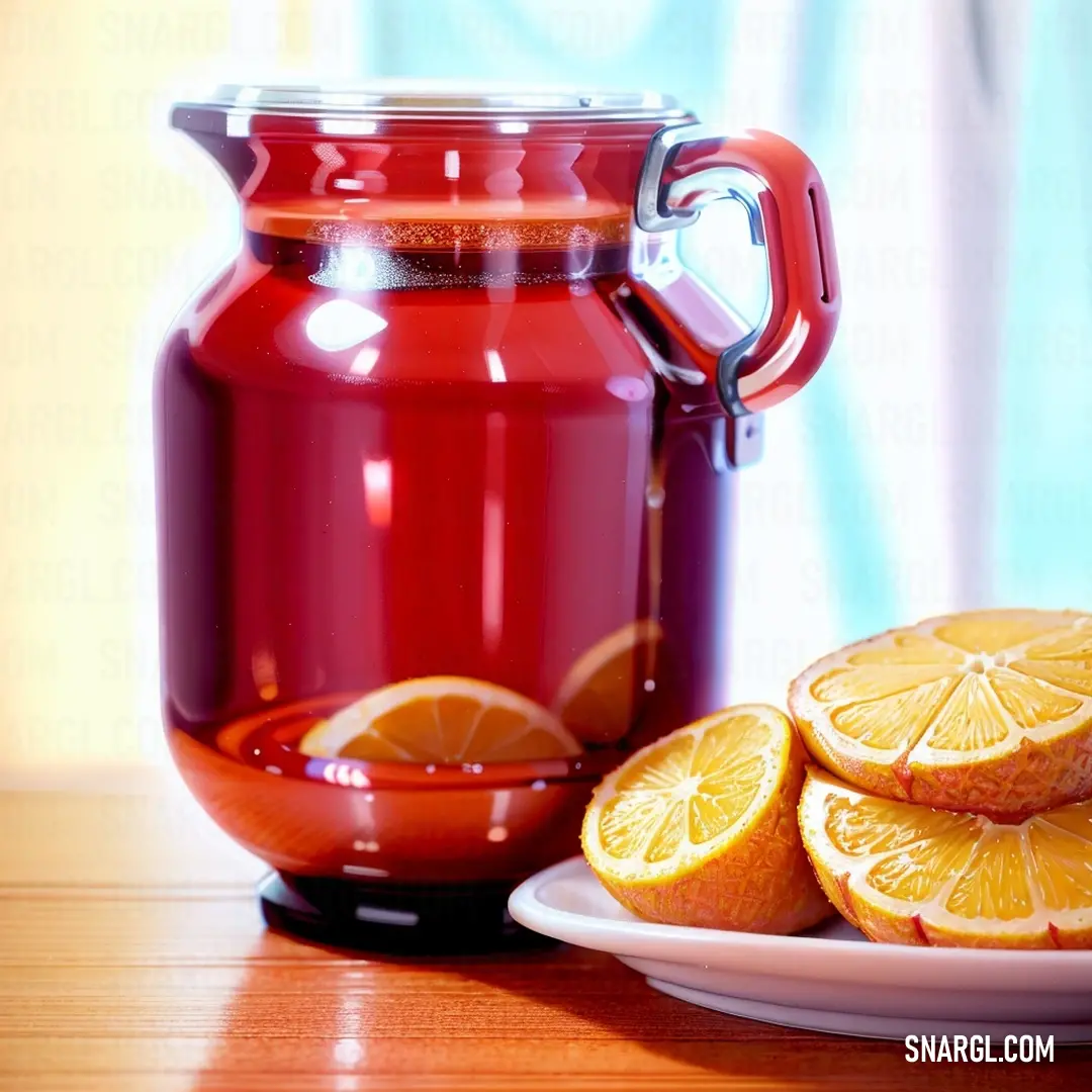 Plate of oranges and a pitcher of liquid on a table