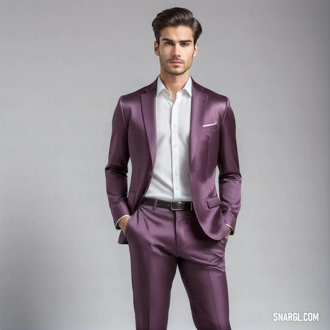 Man in a purple suit posing for a picture with his hands in his pockets