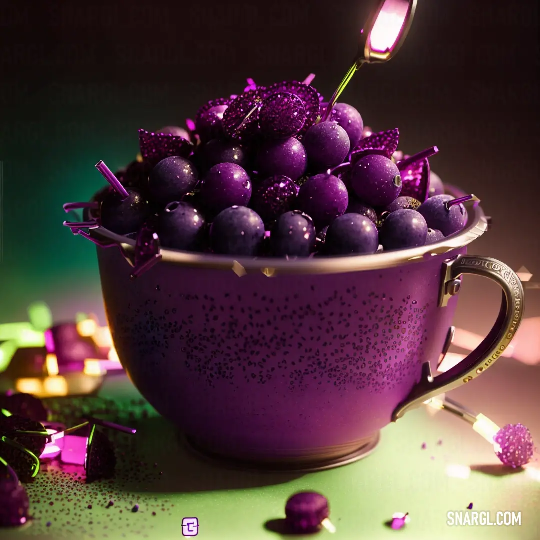 Purple cup filled with purple balls and sprinkles on a table next to a purple cup