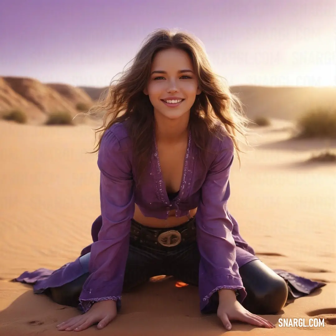 Woman in a purple shirt and black pants on a desert sand dune with her hands in her pockets. Example of RGB 112,41,99 color.