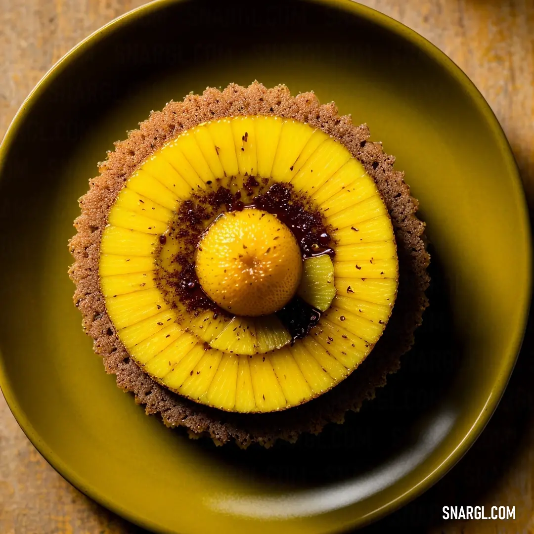 Piece of fruit on a plate on a table top with a spoon and fork in it. Color RGB 255,239,0.