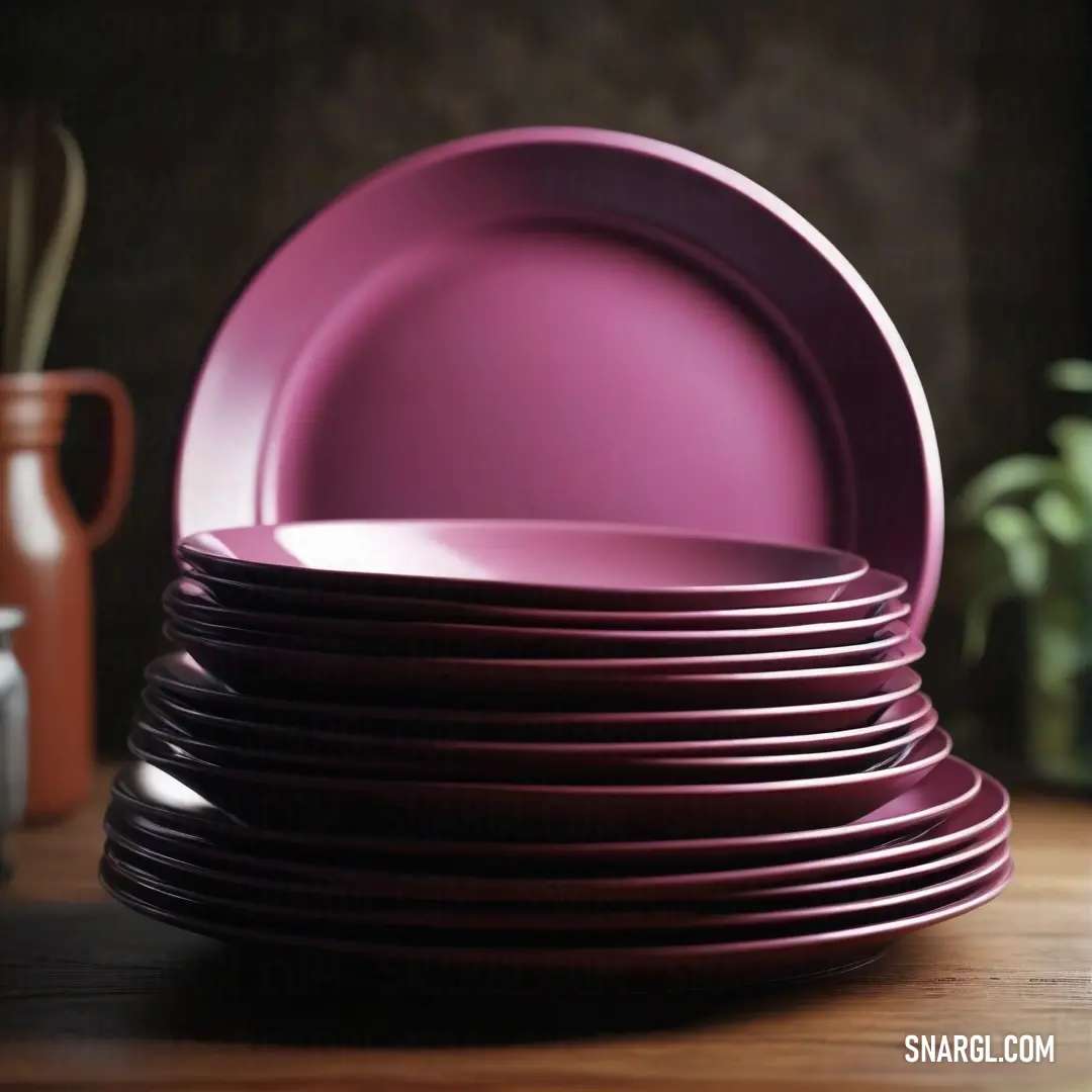 Canonical Aubergine color. Stack of purple plates on top of a wooden table next to a vase and a knife and fork