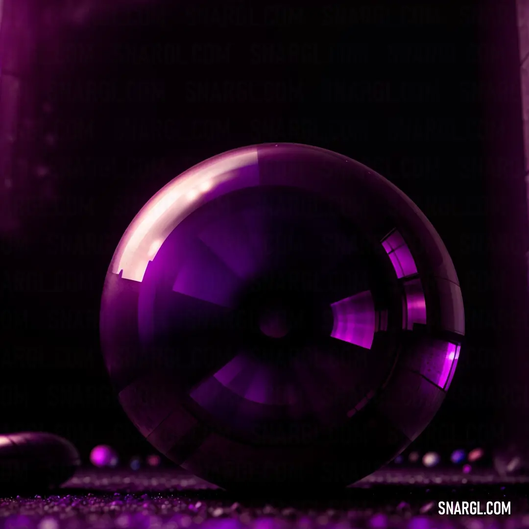 Purple object on the ground in the dark room with a purple light on it's side
