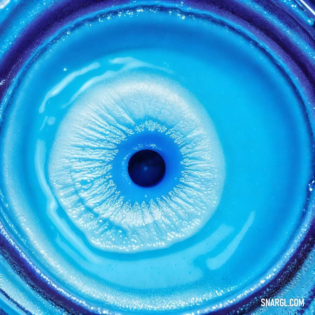 Blue glass bowl with a blue center and a black center in the center of it