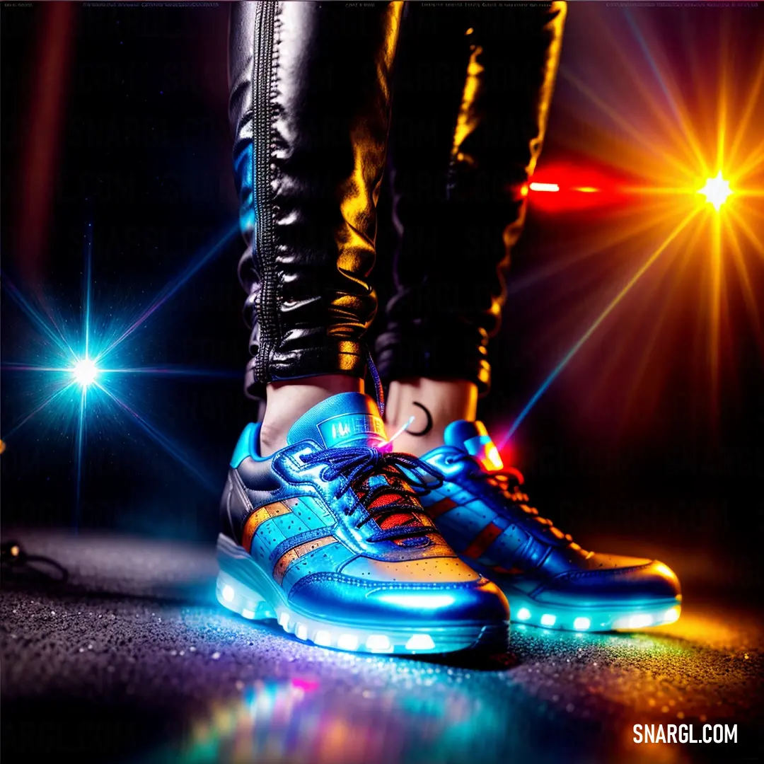 Person standing on a floor with a pair of shoes on it's feet and a light up shoelace