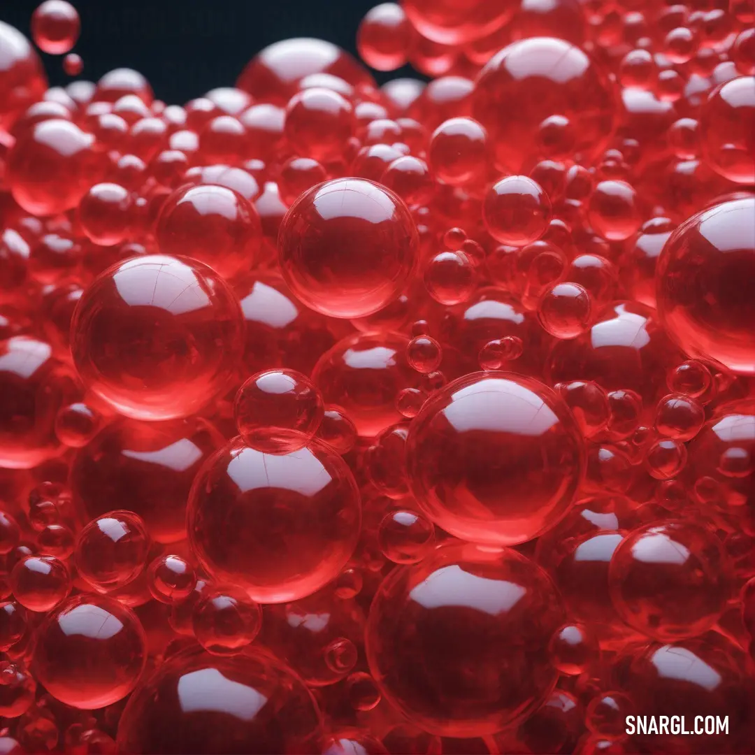 Lot of red bubbles floating in the air together on a black background. Example of #C41E3A color.