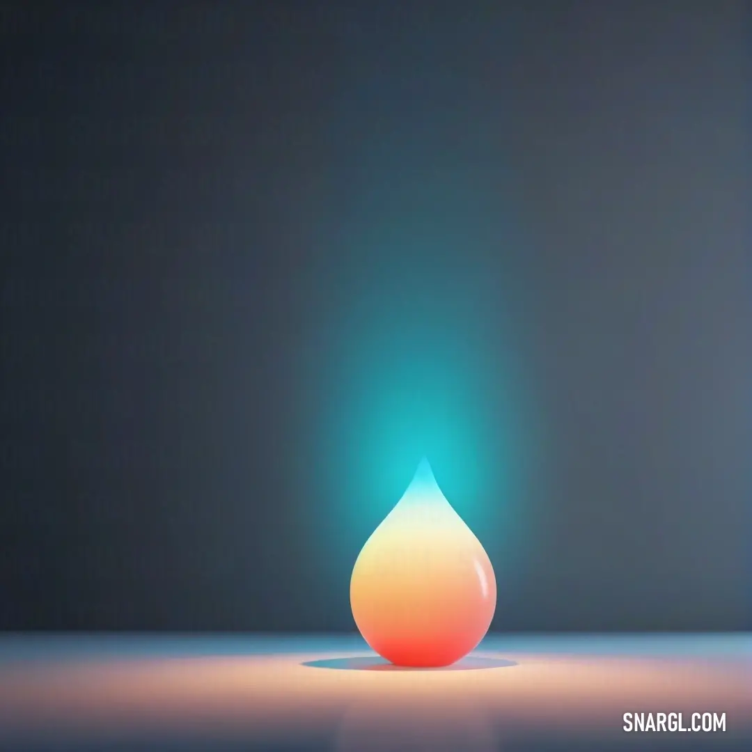 A glowing drop of water, in a vibrant Caribbean green, stands out against a dark background. The light creates a stunning visual effect, as the drop seems to illuminate the surrounding darkness.