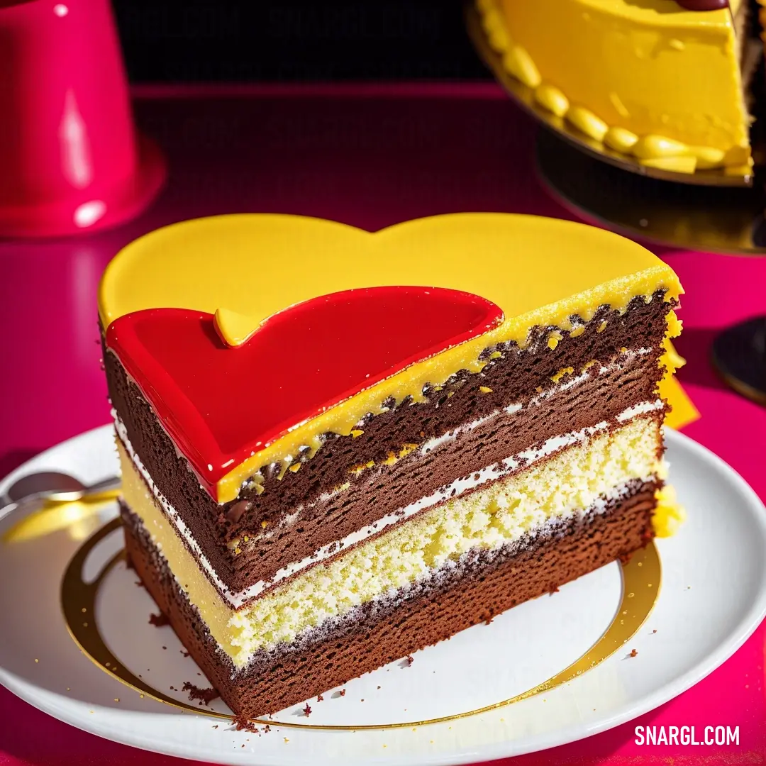 Piece of cake with a heart on top of it on a plate with a fork and a cup