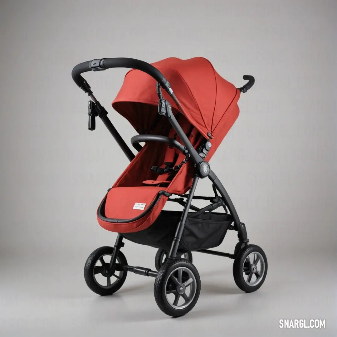 Red stroller with a black handlebar and seat on a gray background. Example of CMYK 0,85,85,30 color.