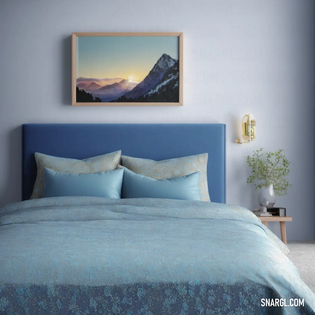 Bed with a blue headboard and a painting above it that is hanging above it