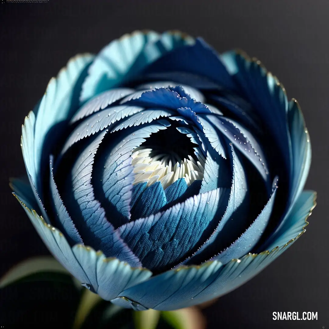 Blue flower with a black background and a white center and a green stem