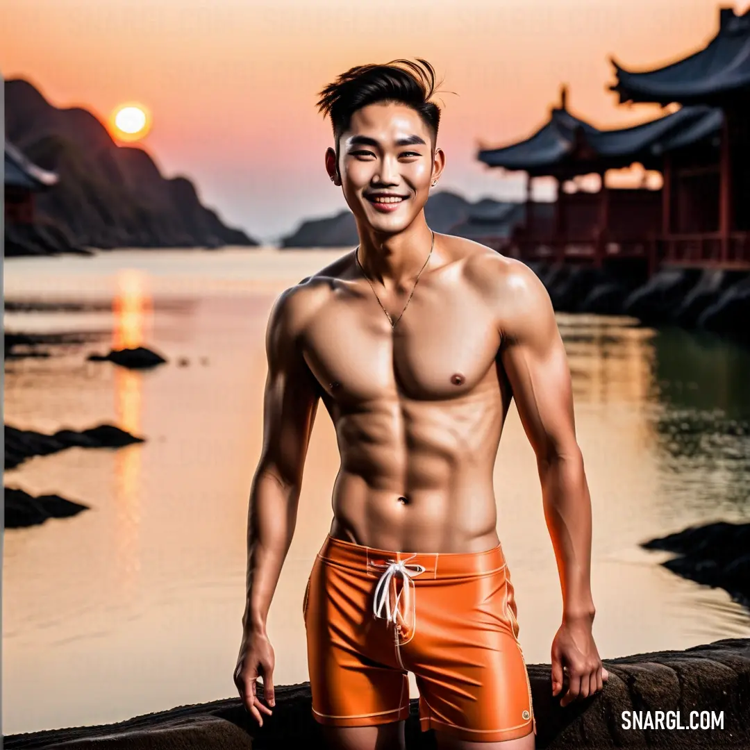 Man with no shirt standing next to a body of water at sunset. Example of Carrot color.