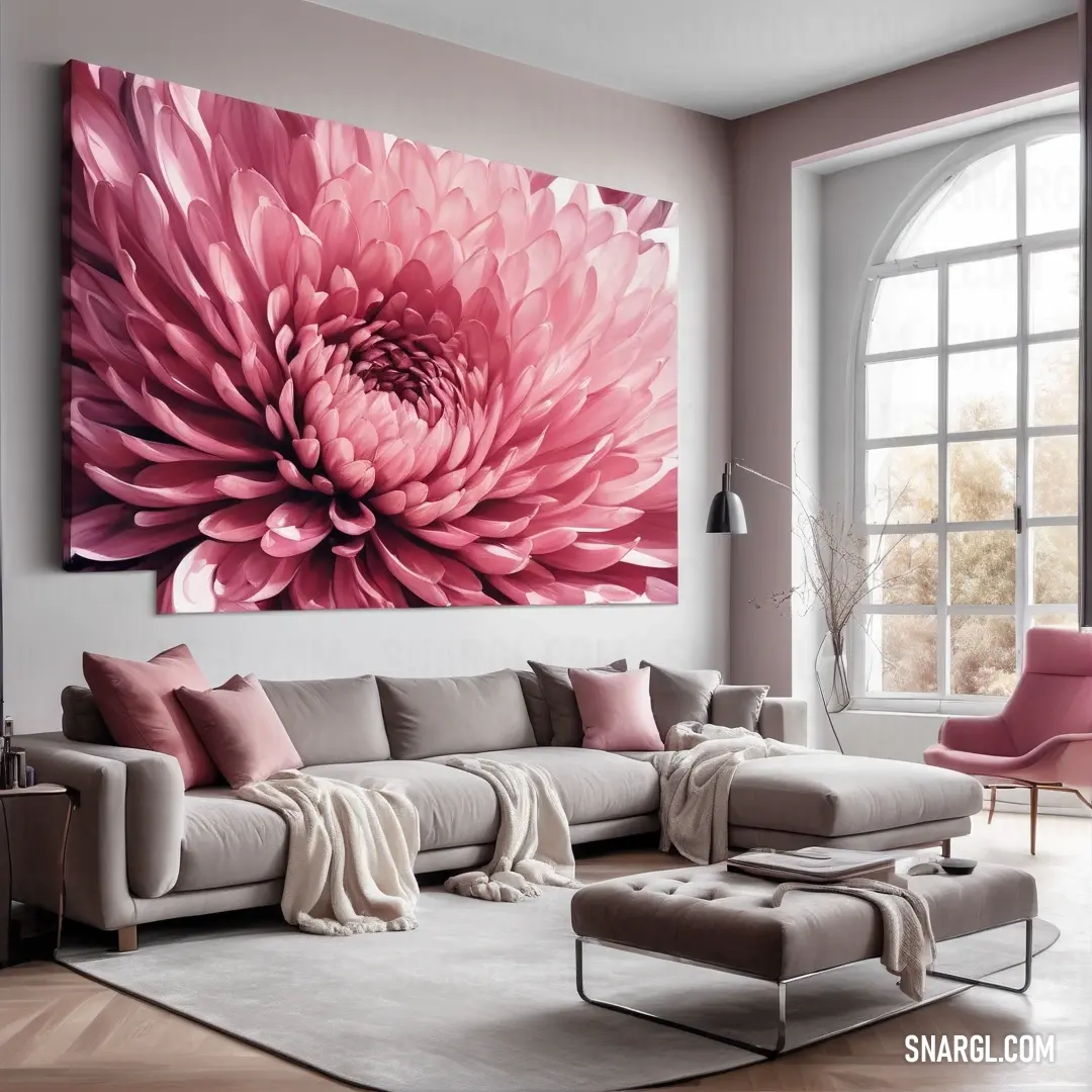 Living room with a large pink flower on the wall and a large painting on the wall above the couch. Example of Cerise pink color.