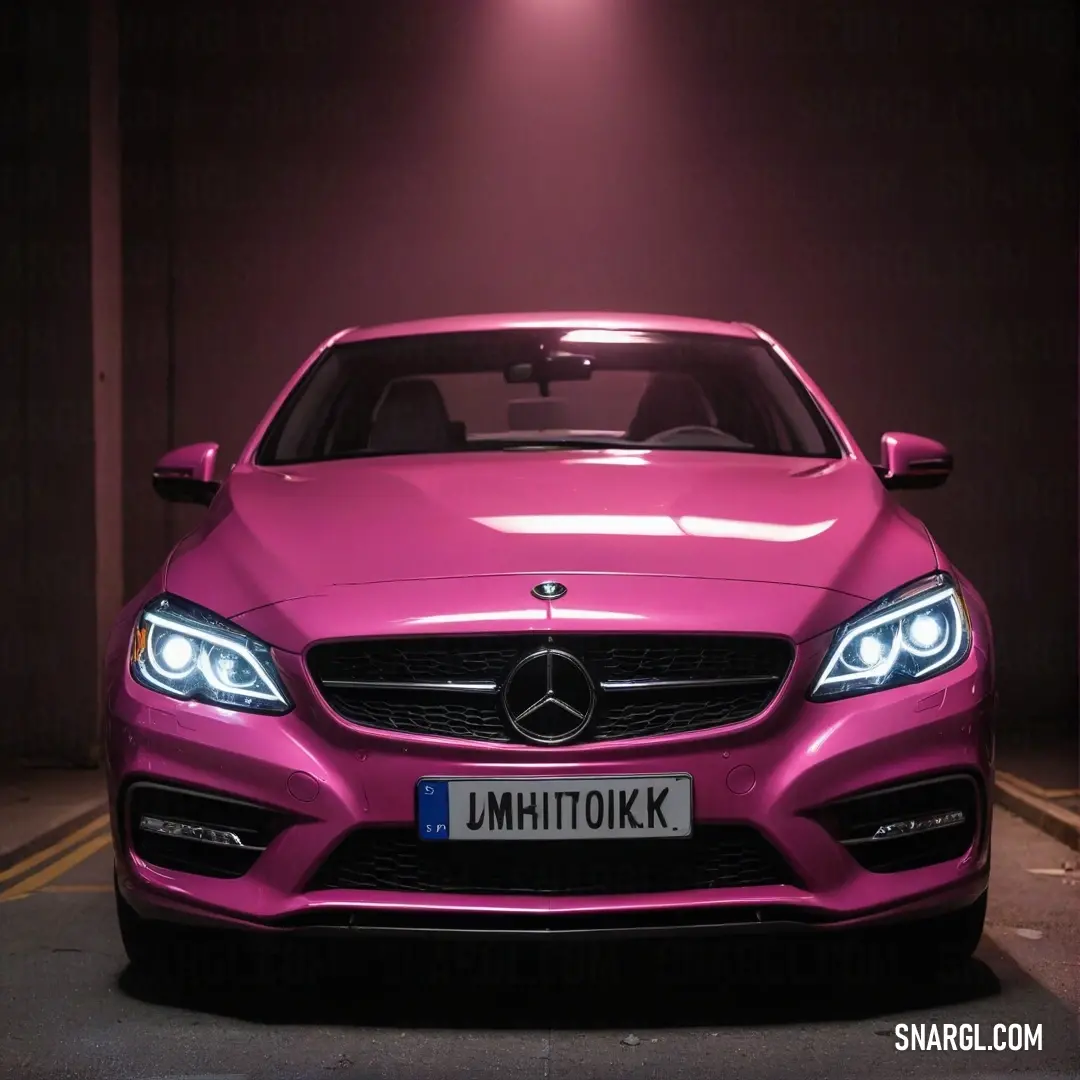 Pink mercedes benz coupe parked in a parking lot at night with a purple light on the front of the car. Example of RGB 236,59,131 color.